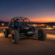 Driver belted into an off-road racing truck on a desert circuit, Buckle Up experience gift