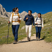 Three friends hiking an alpine meadow trail below granite peaks, Great Outdoors experience gift