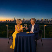 Couple raising champagne flutes on a terrace above the Central Park canopy, Anniversary in New York City experience gift