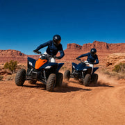 Two riders leaning quad bikes through a dusty desert bend, ATV & Quad Biking Experience Collection experience gift