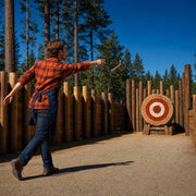 Hatchet spinning toward a bullseye at a forest range, Axe Throwing Experience Collection experience gift