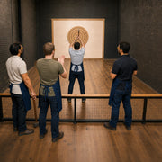 Groom raising an axe as friends watch, Bachelor & Bachelorette in New York City Experience Collection experience gift