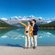 Couple admiring snow-capped peaks at a turquoise lake, Banff & Jasper National Parks Tour experience gift