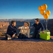 Three friends toasting mugs at a canyon overlook with balloons, Birthday Adventure experience gift
