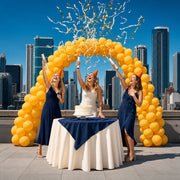 Three friends firing party poppers over a birthday cake on a rooftop, Happy Birthday experience gift