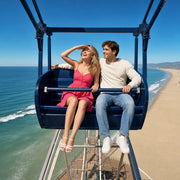 Couple laughing in a pier Ferris wheel gondola above the Pacific, Los Angeles Bucketlist Experience Collection gift