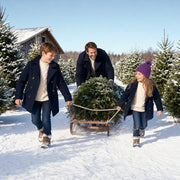 Children pulling a fresh-cut fir on a sled at a snowy tree farm, Santa's Choice experience gift