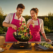 Couple folding dumplings beside a steaming bamboo steamer, Asian Cooking Classes experience gift