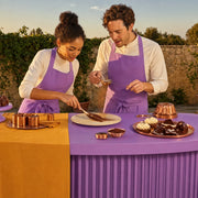 Two cooks plating a layered dessert in low evening sun, Dessert delight experience gift