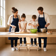 Family of four baking together at a bright kitchen bench, Family Cook Time experience gift