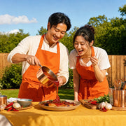 Couple tasting a simmering sauce from a wooden spoon, Secret Sauce experience gift