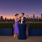 Couple toasting cocktails at a rooftop bar as Midtown lights up, Date Night in New York City experience gift