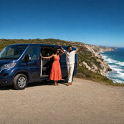Couple admiring a coastal view beside their van at a clifftop overlook, Day Trips & Excursions experience gift