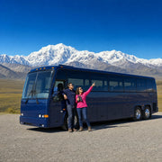 Couple viewing a snow-capped peak from a scenic pullout, Denali & Alaska Parks Tour experience gift