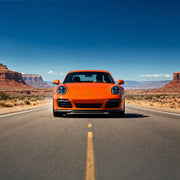 Driver racing a sports coupe down an open desert highway, Fast Lane experience gift