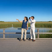 Guide and guest birdwatching from a wetland boardwalk, Eco & Sustainable Tours experience gift