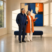 Grandparents admiring an abstract painting in a sunlit gallery, Art & Gallery experience gift
