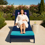 Woman reclining on a lounger in a garden spa in morning sun, Spa Glow experience gift