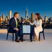 Couple toasting with wine at a quiet rooftop dinner over the skyline, Parents Only experience gift