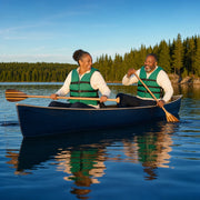 Couple paddling a canoe together on a calm lake at evening, Outdoor Adventure experience gift