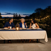 Three generations sharing dinner under string lights at dusk, Generations Together experience gift
