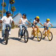 Family riding beach cruiser bikes on the Mission Beach boardwalk, Family Fun in San Diego experience gift