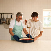 Father and son making deep-dish pizza in a Chicago kitchen, Father's Day in Chicago Experience Collection experience gift