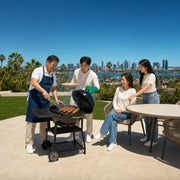Father grilling as his family gathers on the patio, Father's Day in San Diego Experience Collection experience gift