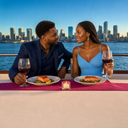 Couple dining on salmon and wine as the skyline slides past, Dinner cruise experience gift