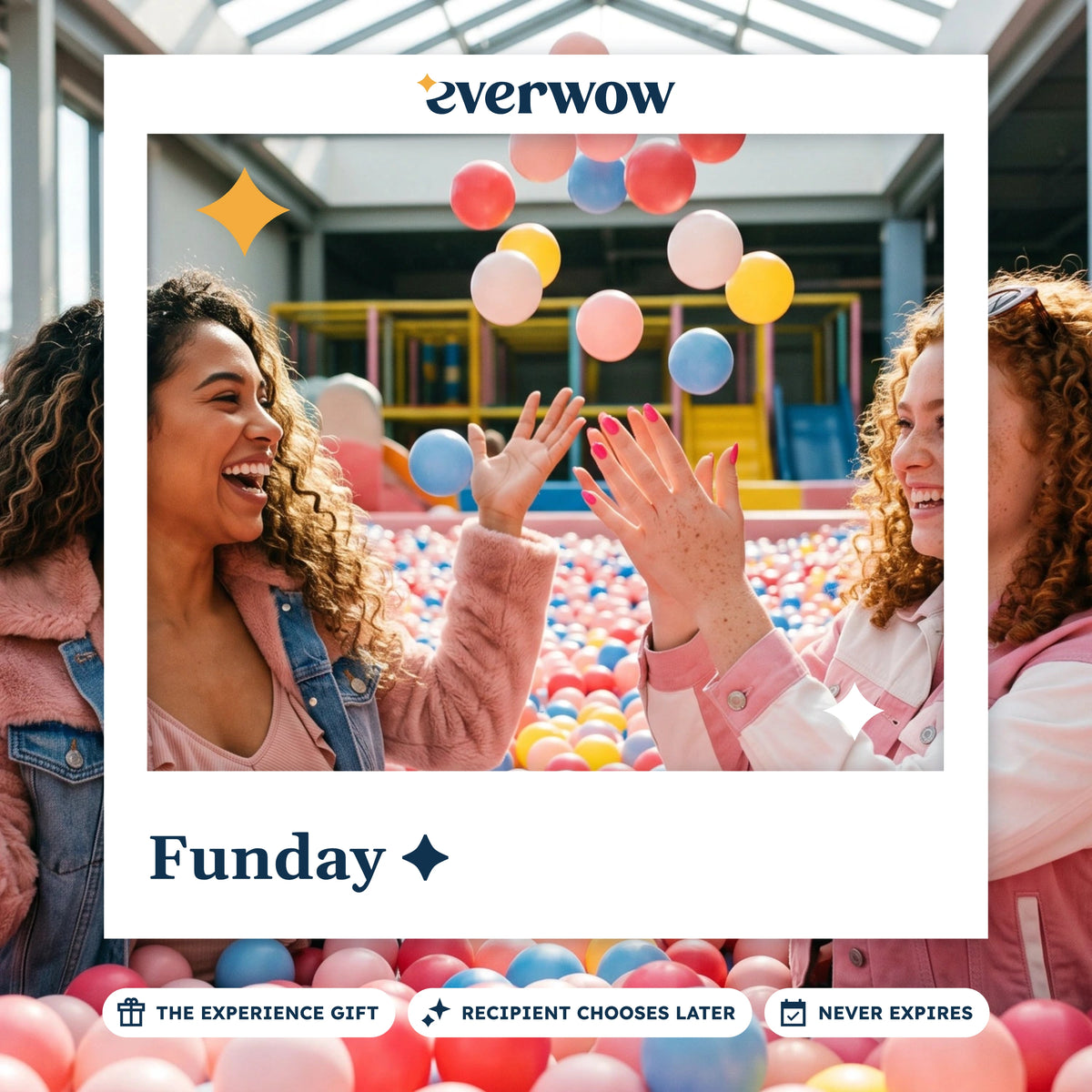 Everwow Funday experience gift card: two friends laughing and tossing balls in a ball pit