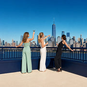 Three friends raising cocktails at a Manhattan rooftop, Girls Day Out in New York City Experience Collection experience gift