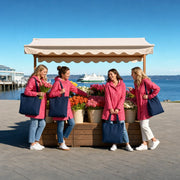 Four friends at a flower stall in a Seattle market, Girls Day Out in Seattle Experience Collection experience gift