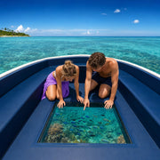 Couple watching reef fish through a boat's glass floor panel, Glass Bottom Boat Tours experience gift