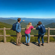 Three friends at an overlook taking in blue-gray ridgelines, Great Smoky Mountains Tour experience gift