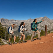 Guide leading two hikers up a switchback below granite peaks, Guided Hikes experience gift