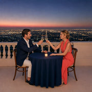 Newlyweds toasting at a candlelit rooftop table, Honeymoon in Los Angeles Experience Collection experience gift
