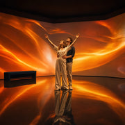 Couple immersed in a wash of moving projected light, Light, Sound & Immersive Shows experience gift
