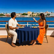 Couple sharing lunch on a cruise sun deck as the shoreline passes, Lunch Cruise experience gift