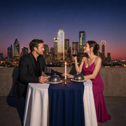 Couple lingering over a private rooftop dinner above the skyline, Dallas Iconic Bucketlist Luxe experience gift
