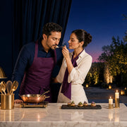 Couple plating a course on a chef's garden terrace at dusk, Iconic Cook Together Luxe experience gift