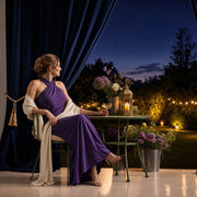 Mother and daughter clinking champagne coupes in a dusk garden, Iconic Mom's Choice Luxe experience gift
