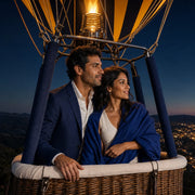 Couple in a hot air balloon basket over a dusk coastline, Iconic Air Adventure Luxe experience gift