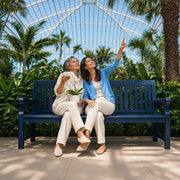 Mother and daughter with an orchid under a conservatory canopy, Mother's Day in Chicago Experience Collection gift