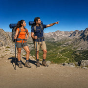 Couple with packs cresting an alpine pass above switchbacks, Multi-Day Trek experience gift