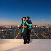 Couple embracing at a deck rail above a glowing city, Observation Decks & Viewpoints experience gift