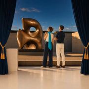 Couple studying an abstract bronze in a sculpture courtyard, Iconic Arts & Culture experience gift