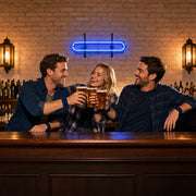 Three friends toasting pint glasses under a neon bar glow, Pub & Bar Crawls experience gift
