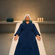 Woman resting on a spa treatment table, San Diego Relaxing Experience Collection experience gift