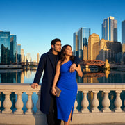 Couple leaning on the riverwalk rail beneath glass towers at evening, Chicago Romantic experience gift
