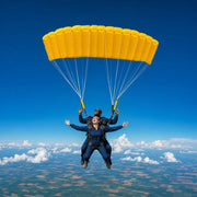 Tandem skydivers drifting under one canopy above patchwork farmland, Skydiving experience gift